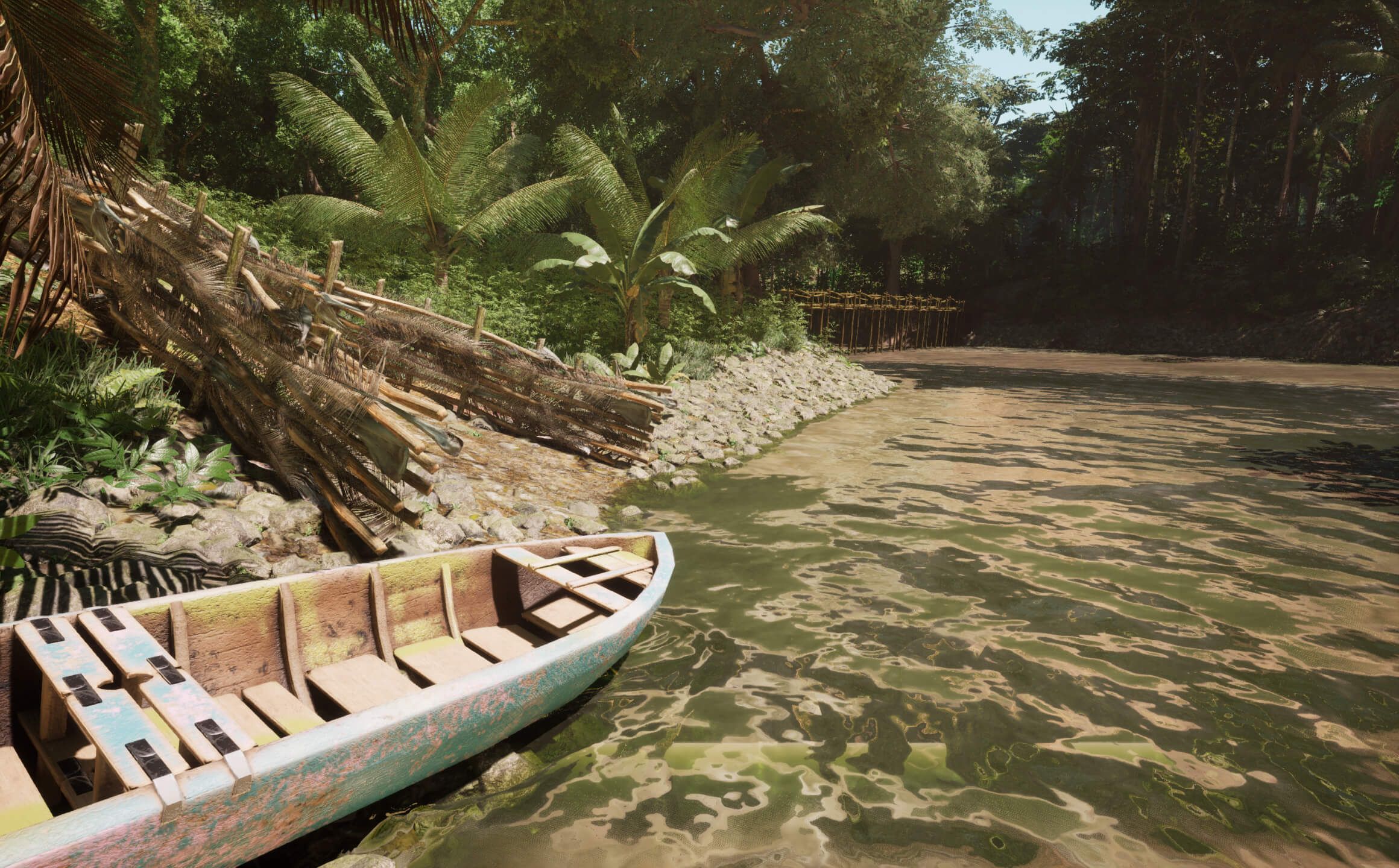 A boat on the shore by the Dak Bla river